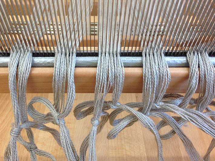 sleyed warp with crammed and spaced ends