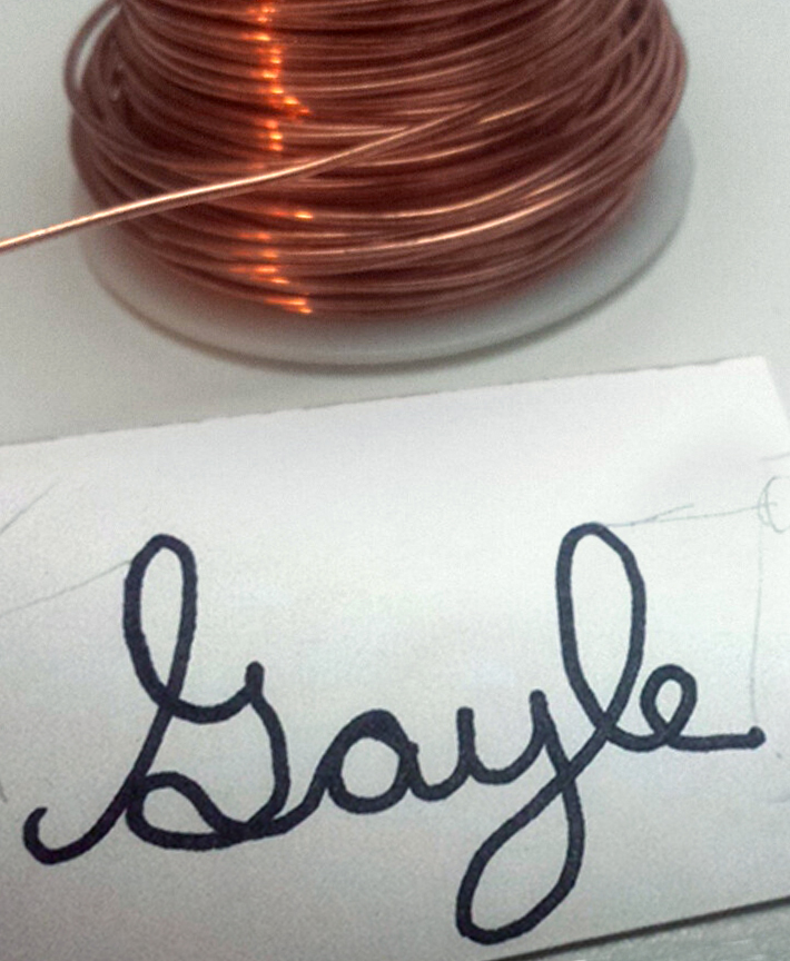 Spool of wire and template for handwriting jewelry