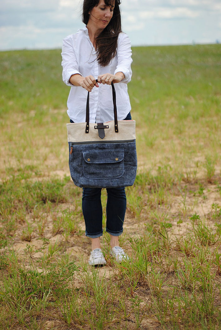 Woman holding a purse made with waxed fabric