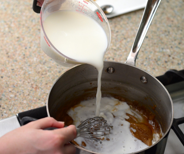 Adding milk to the base of a homemade Butterscotch Pudding