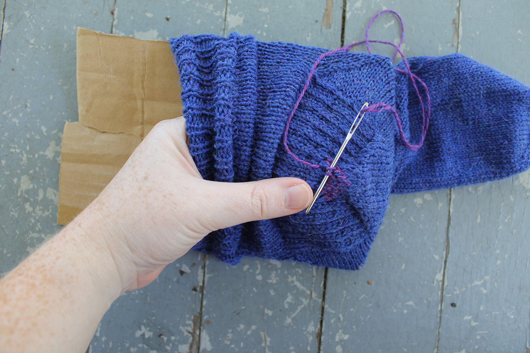 Sliding sock heel onto cardboard