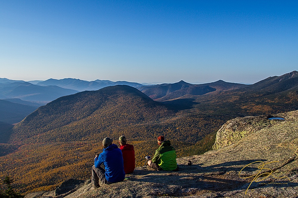 Three hikers enjoying the view over the Pemigewasset Wilderness