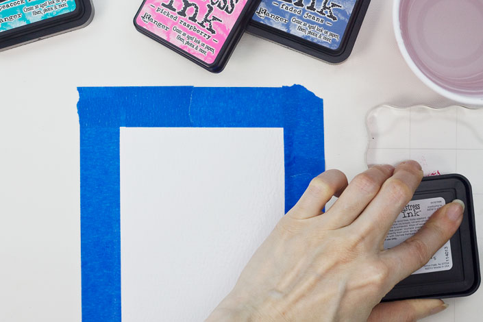 Smooshing Distress Ink onto an acrylic block