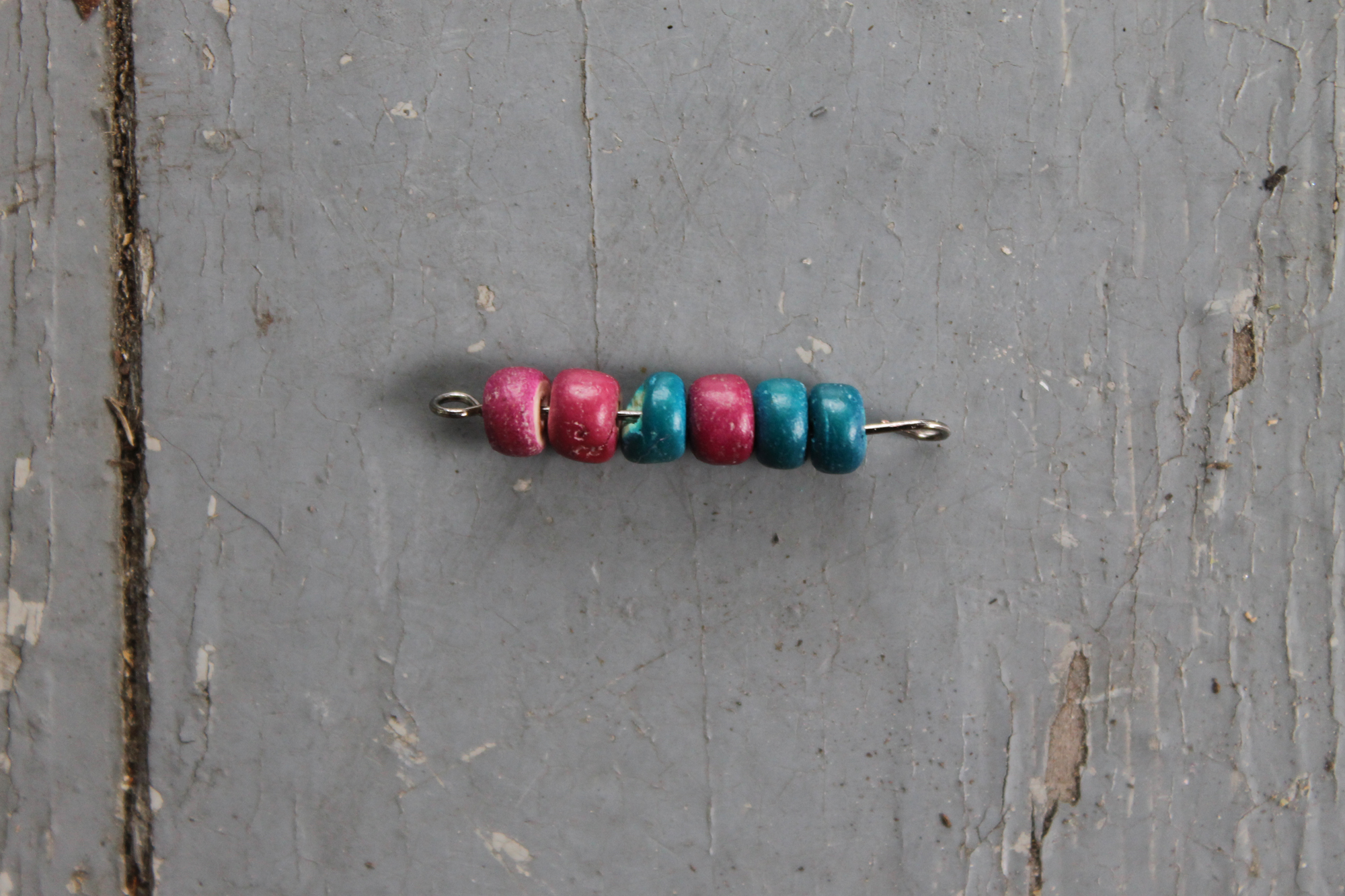 Eye pin with loops on both ends