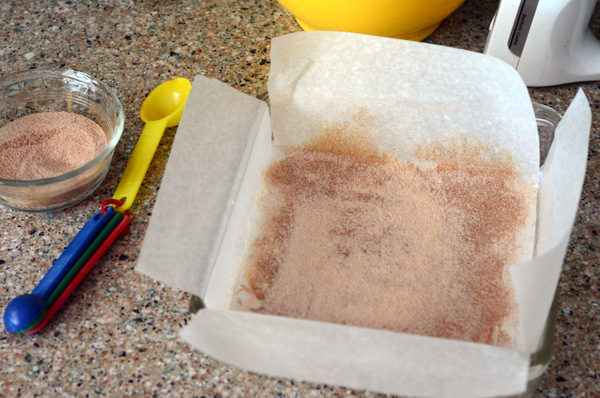 Preparing a pan for Snickerdoodle Bar Cookies