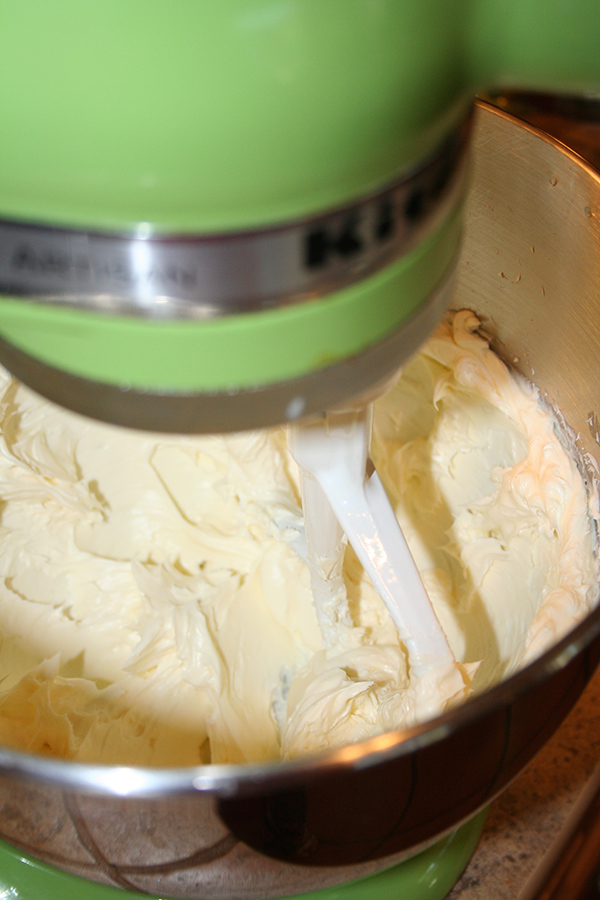Creaming butter  to make cream cheese frosting