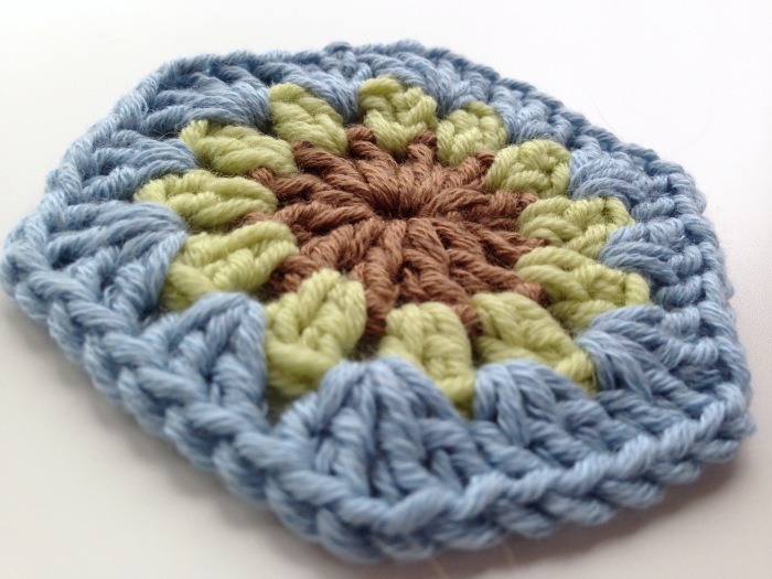 Flower centre crochet hexagon motif completed