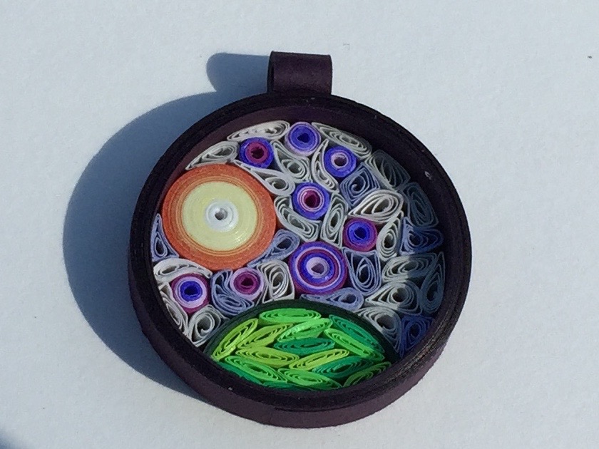 Quilled background pendant