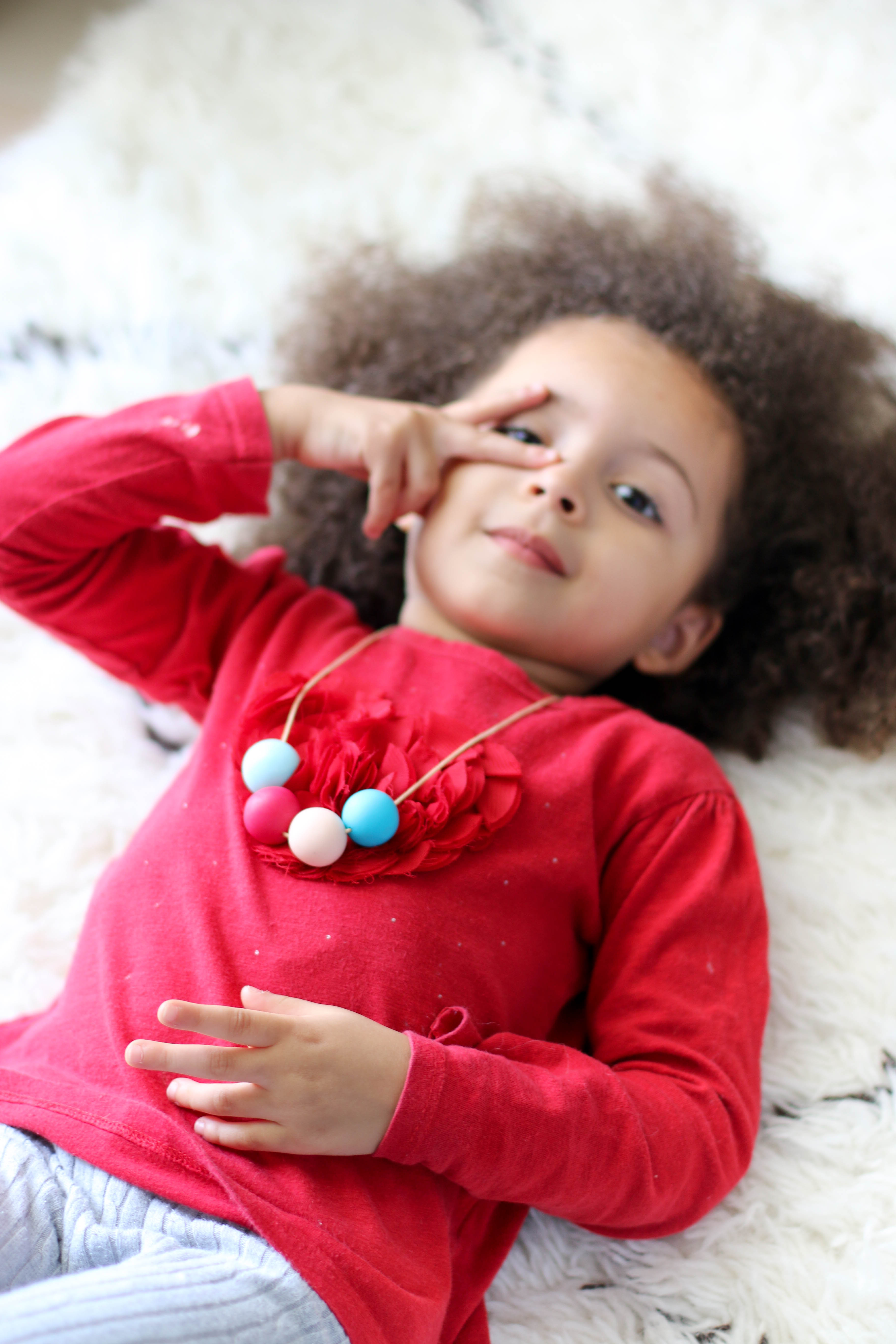 Child Wearing a Polymer Clay Necklace