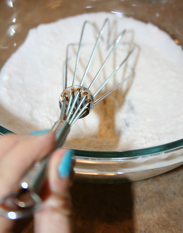 Sifting flour with a whisk