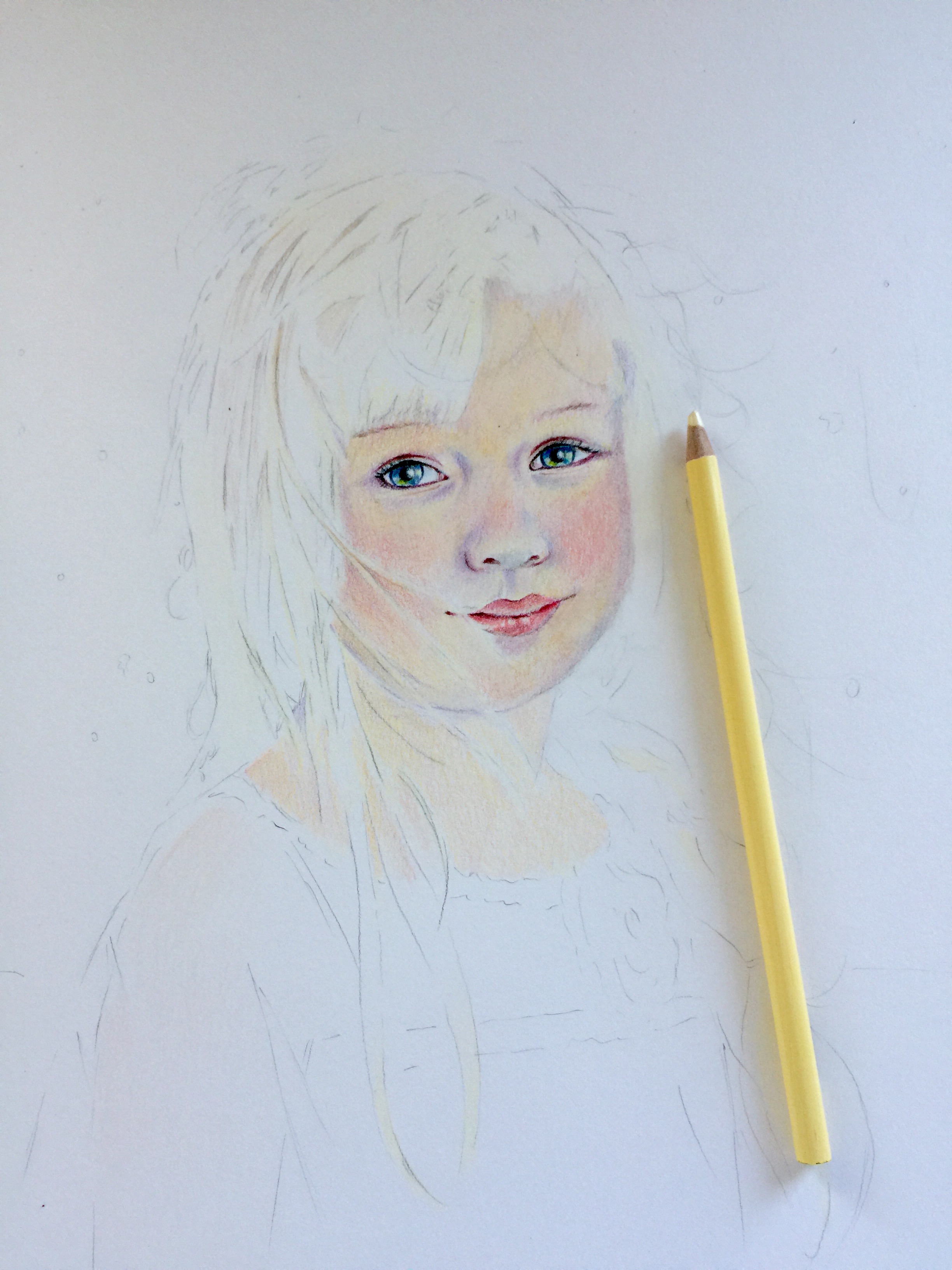 Adding flesh tones to a colored pencil portrait