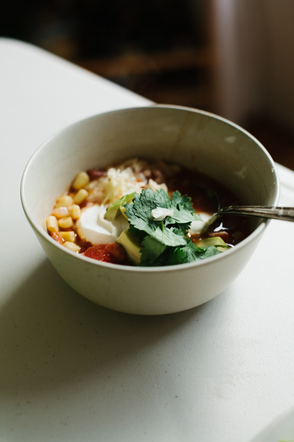 serving tortilla soup with all the toppings