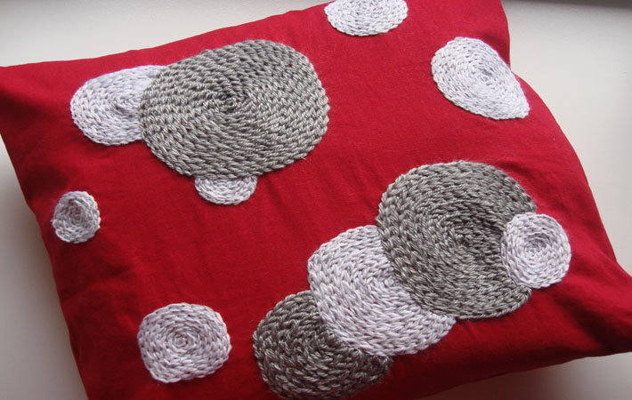 Red Pillow With Embroidered Circles