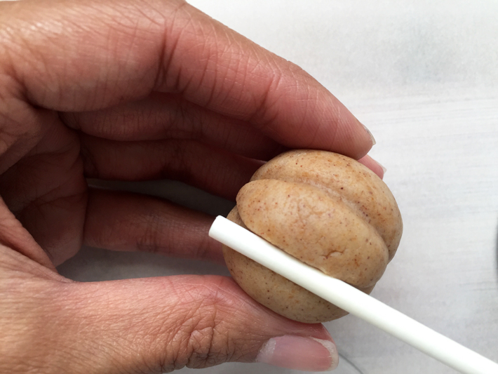 Shaping jack-o'-lantern cake pops