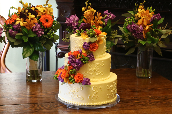 Photograph of wedding cake and flowers