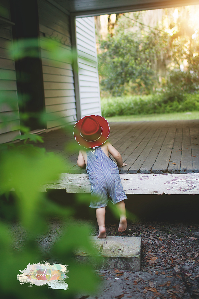 curious toddler boy red hat