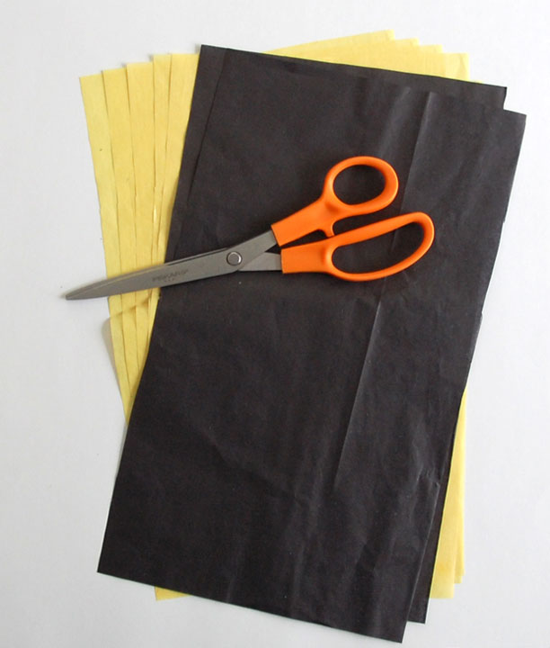 Cut 5 yellow and 2 black papers to 7" x 12"