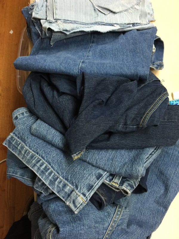 pile of denim jeans