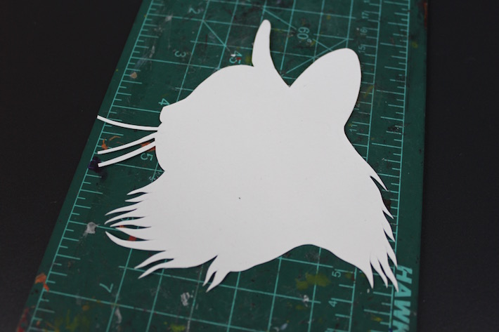 Cat silhouette cut out of bristol paper