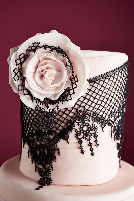 Elegant edible lace cake with pink sugar rose