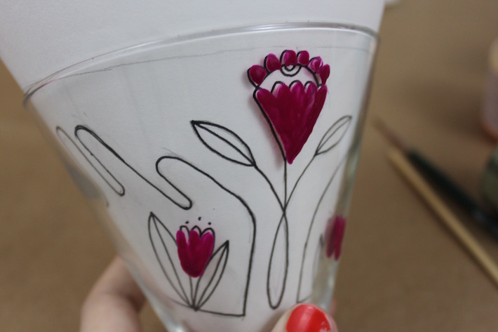 Beginning to paint a design on glass