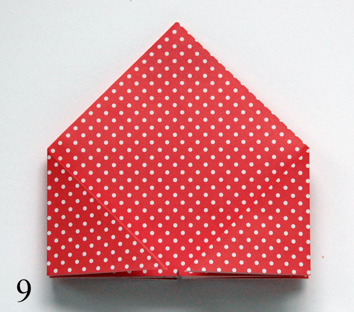 Step 9: Flip over and repeat folding in corners