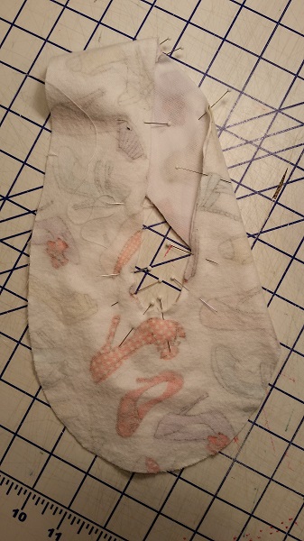 upper inner edges stitched together