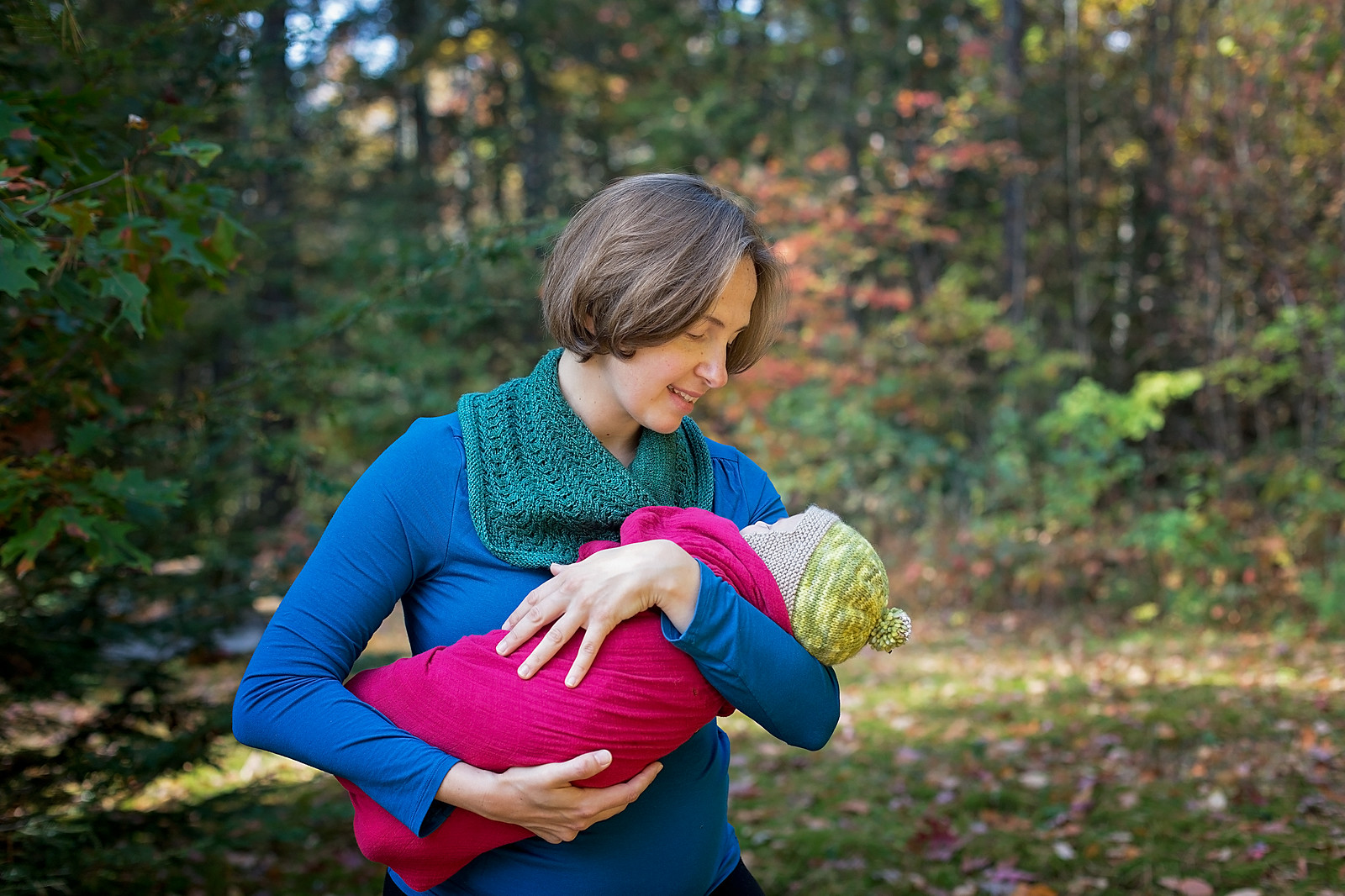 Baby sleeping in mother's arms