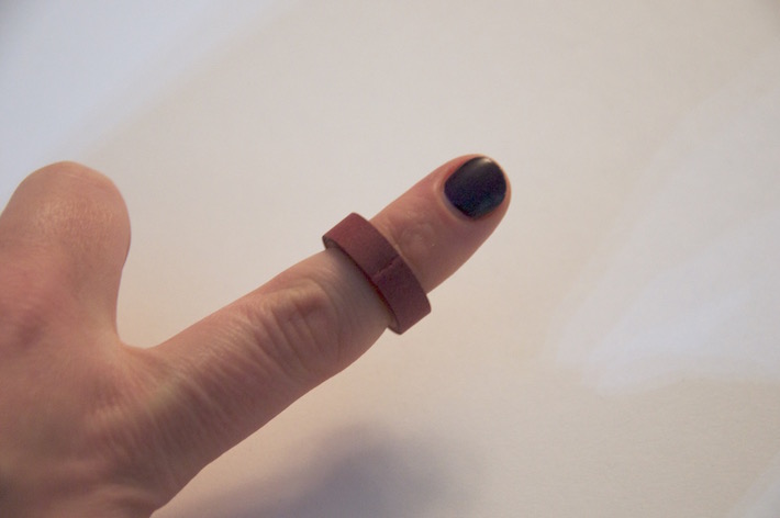 Image of quilled ring with ripped paper edge