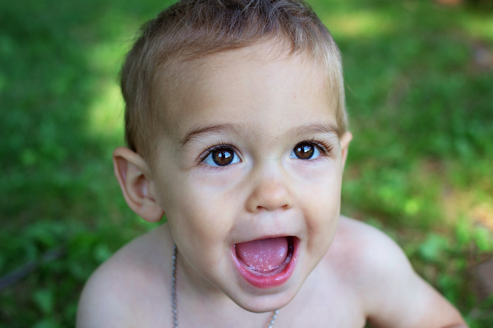 Baby boy smiling at camera