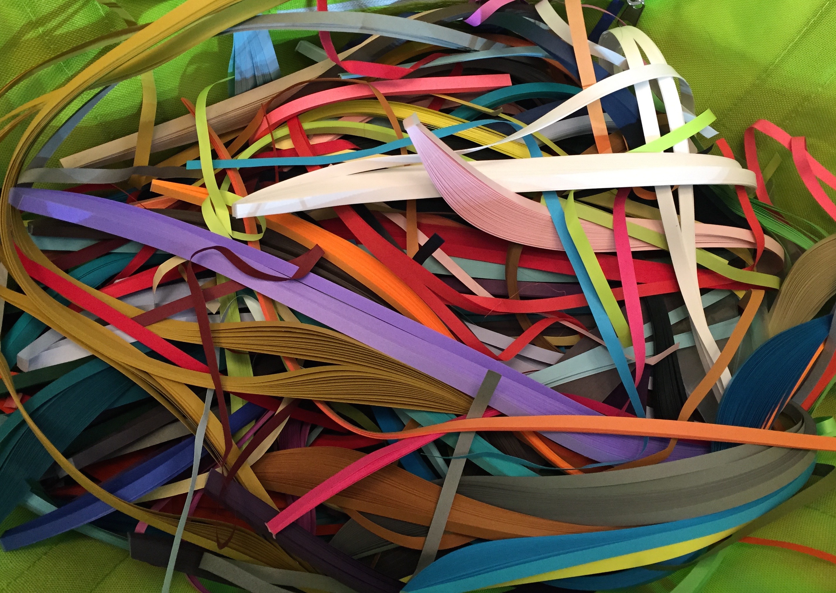 Image of a messy box of quilling paper