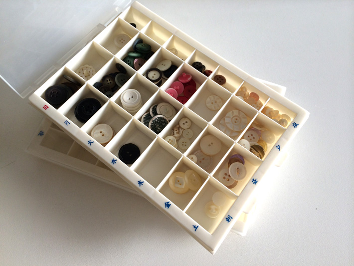 Buttons organized in pill trays - a sewing room organization hack