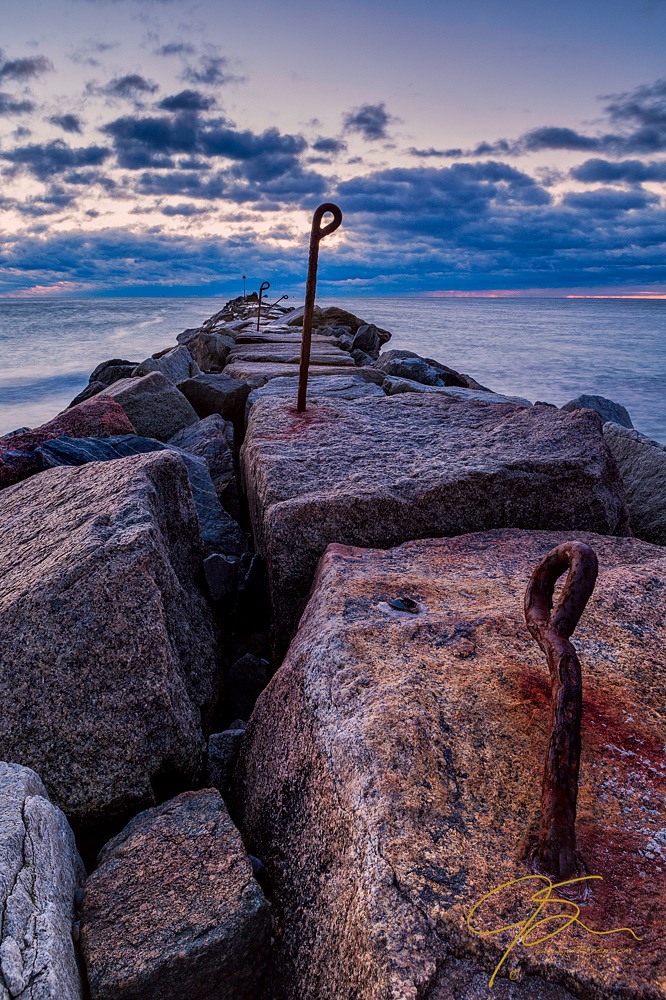 The rock jetty at Hampton Beach State Park in sharp focus from foreground to background.