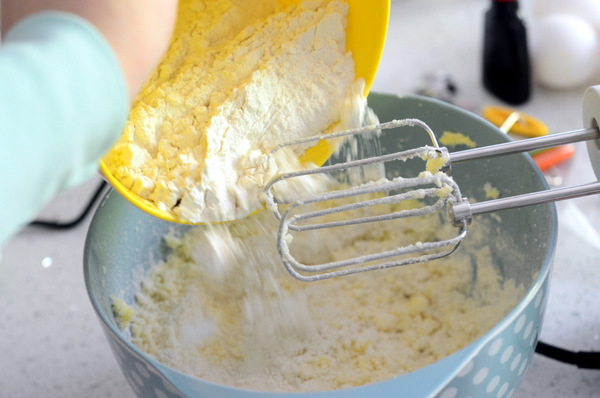 Adding Flour to Butter Mixture for Funfetti Sheet Cake