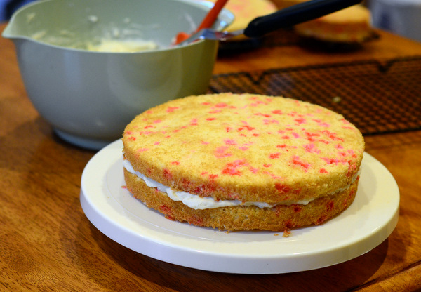 Second Layer of Cake Being Placed on Layer Cake