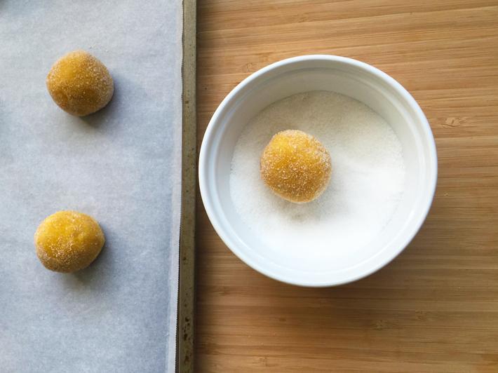 Roll lemon cookie dough portions in sugar