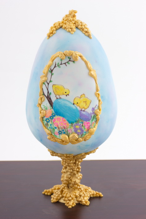Place molded grapes on top of egg