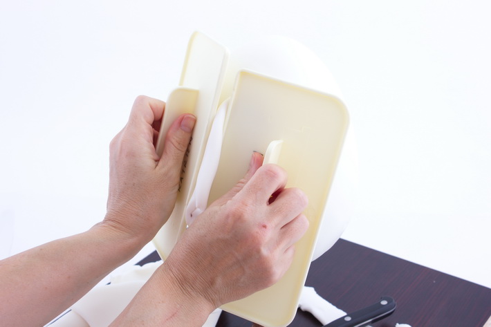 Press fondant edges together
