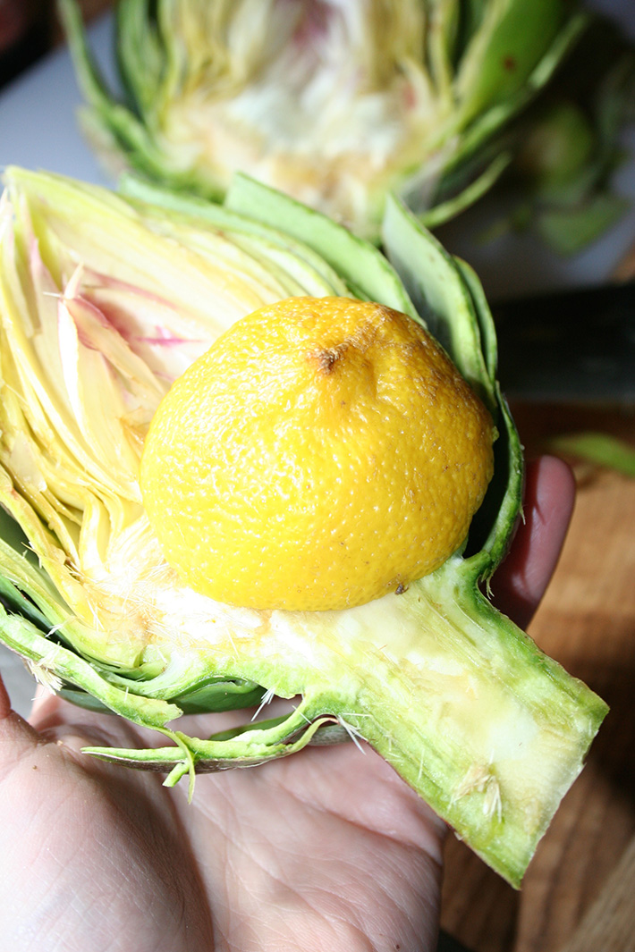 Rub an artichoke with lemon before cooking in the microwave