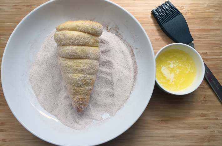 roll donut ice cream cone in cinnamon and sugar