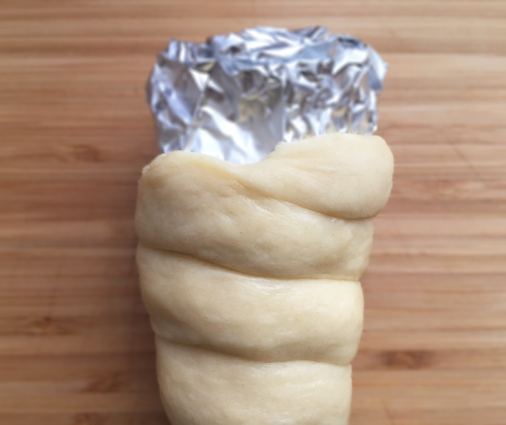fold and pinch ends of donut ice cream cone dough