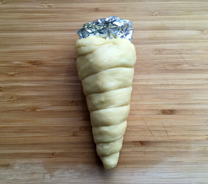 donut ice cream cone dough wrapped around foil cone