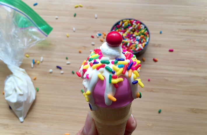 add marshmallow, sprinkles, cherry to ice cream cone cake pops