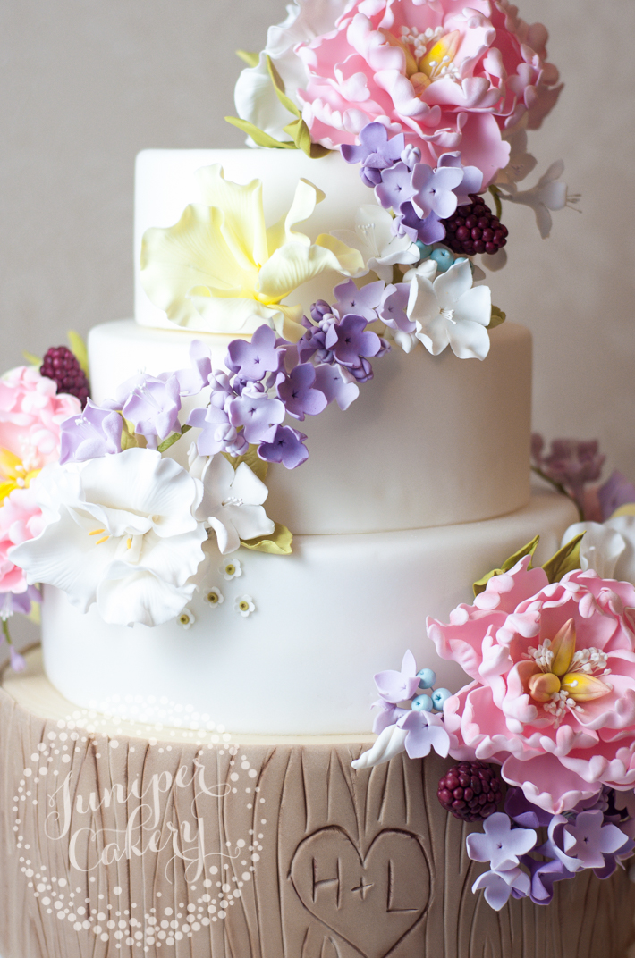 Floral cake with fun tree bark effect by Juniper Cakery