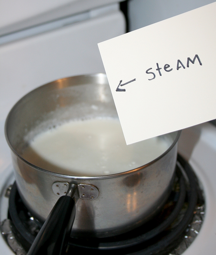 Steam rising evaporated milk