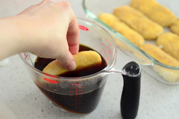 Dipping Ladyfingers in Coffee to Make Tiramisu