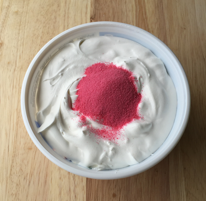 add strawberry powder to whipped topping