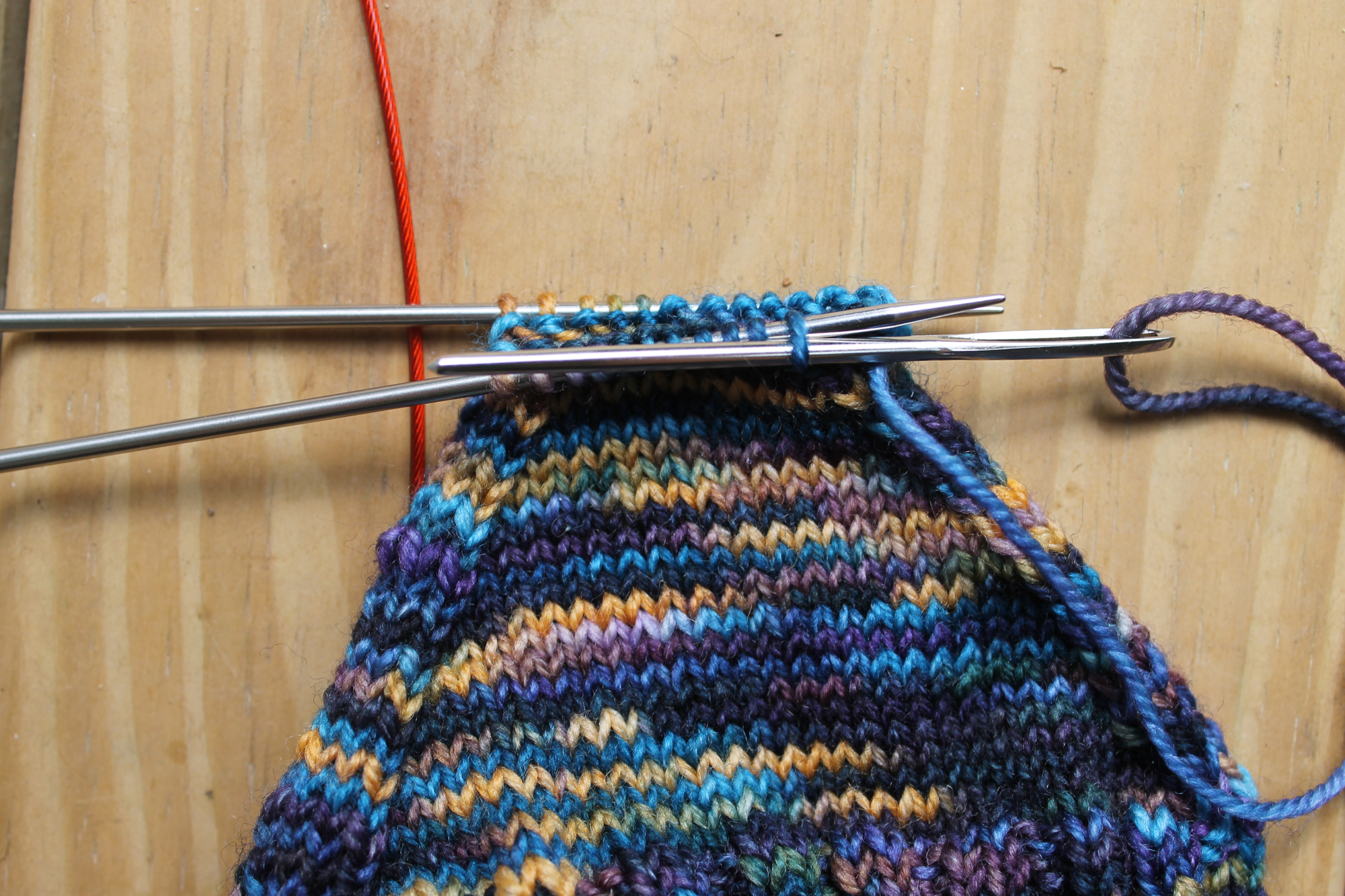 Inserting purlwise on front needle