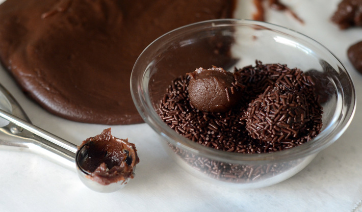 Rolling Homemade Brigadeiros in Chocolate Sprinkles
