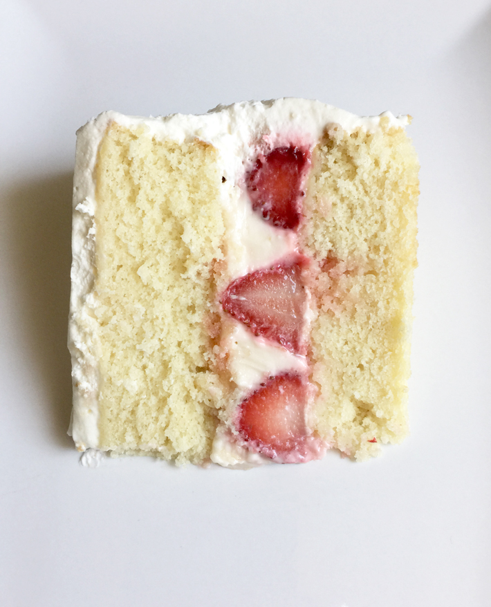 A Slice of Cake With Strawberry Cake Filling